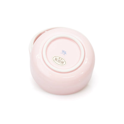 Maker's marks on the underside of the pink porcelain box.