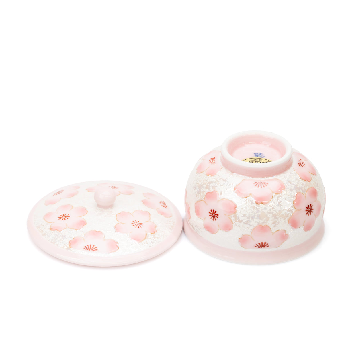 Lid and underside of the pink cherry blossom teacup.
