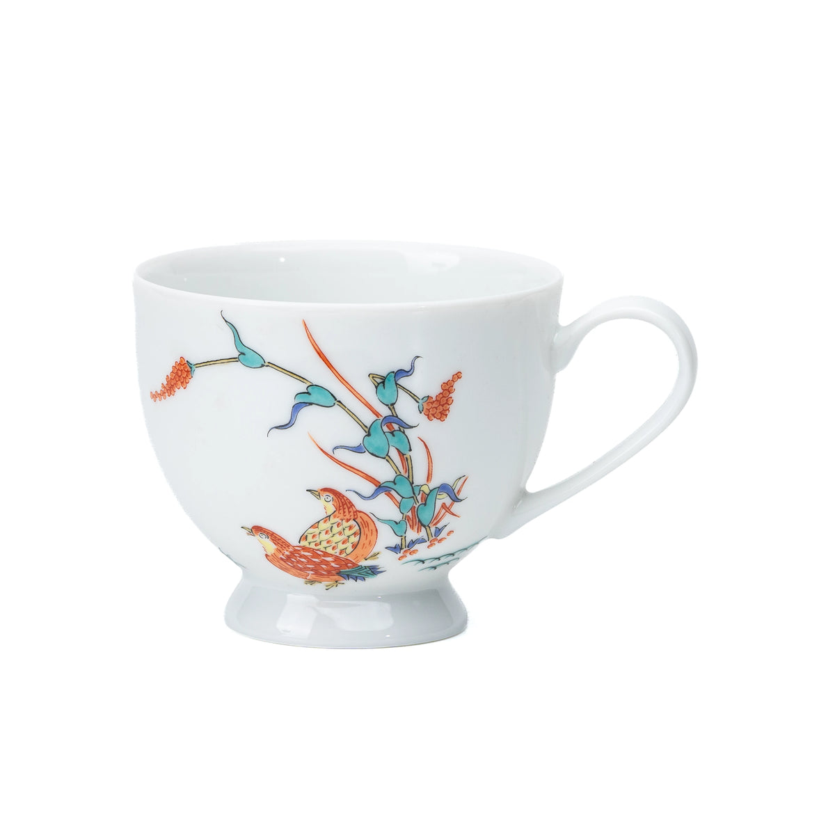 White porcelain cup with quail and red berries, viewed from the side.