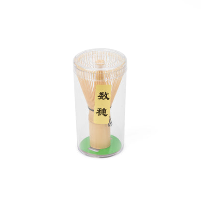 Angled view of the packaged bamboo Kazuho whisk and its label.