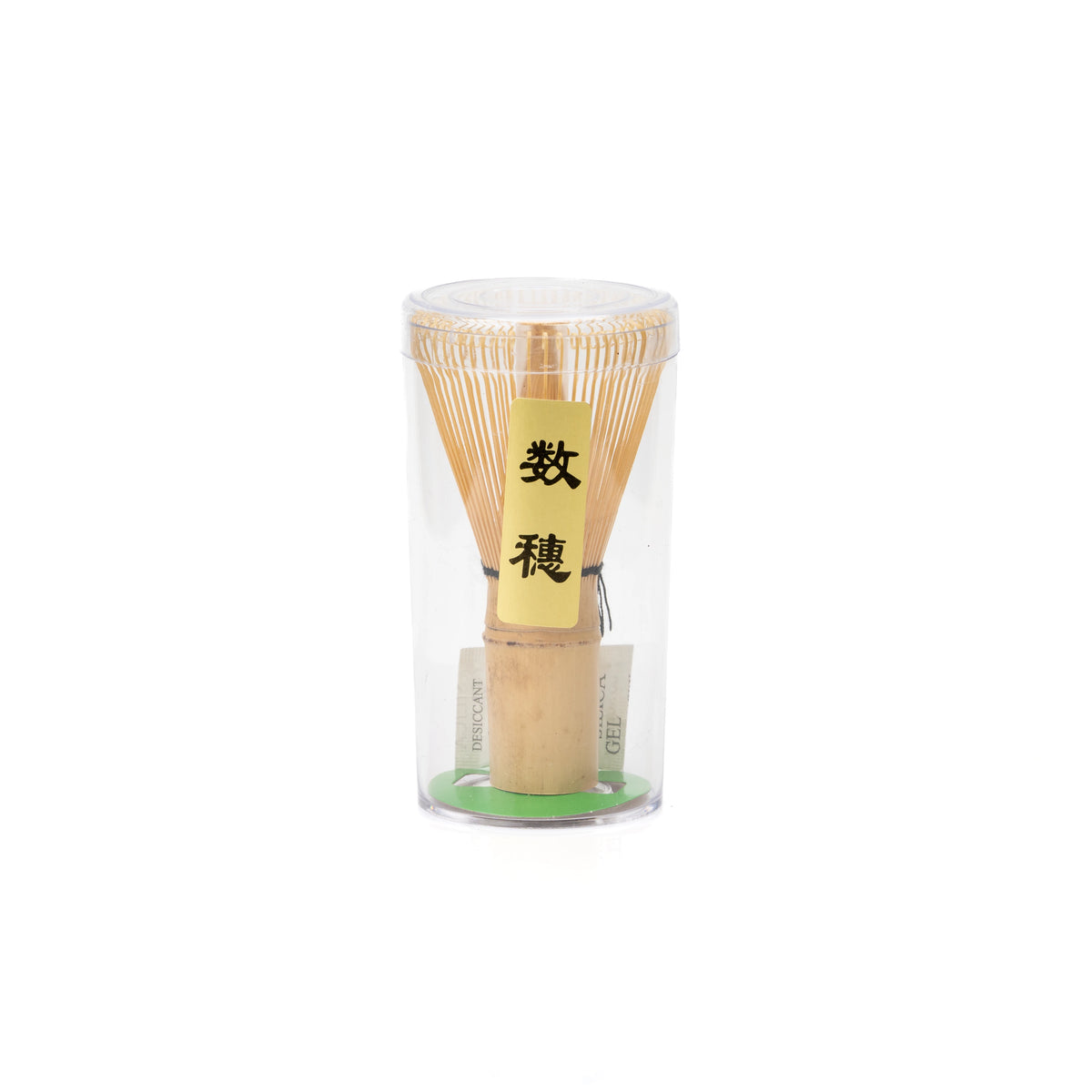 Bamboo Kazuho matcha whisk in its clear protective container on white.