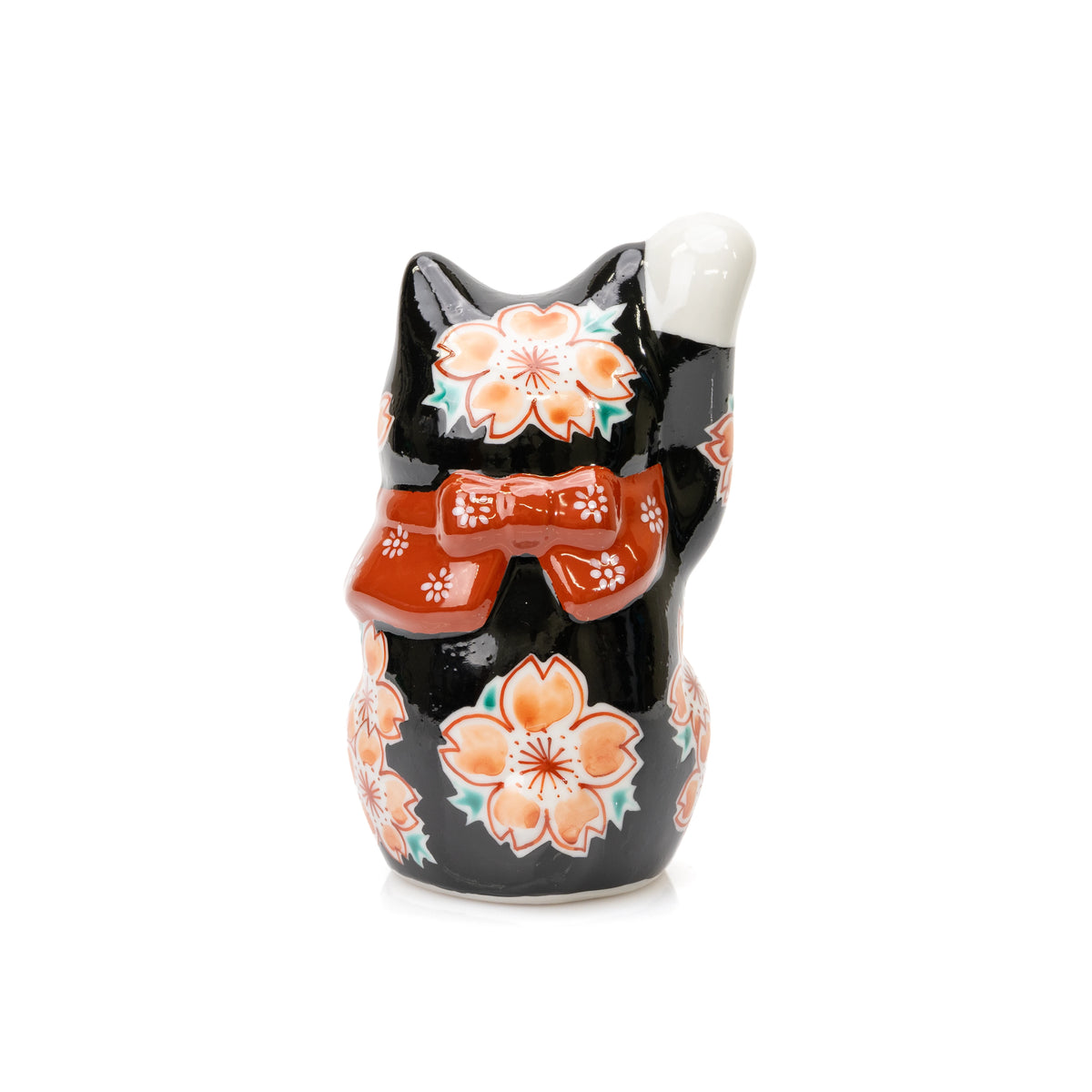 Back view of the black Kutani lucky cat with cherry blossoms and a red floral bow.