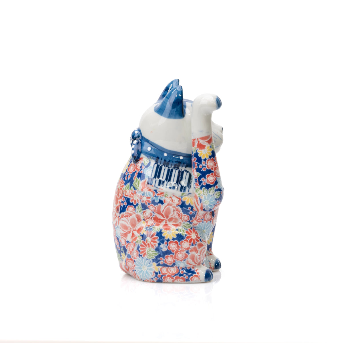 Opposite side of the lucky cat with pink and orange flowers.