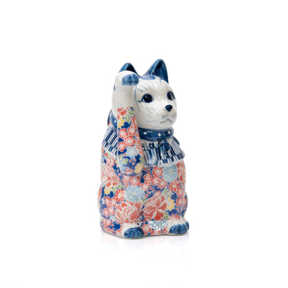 Angled front view of the blue floral cat and raised paw.