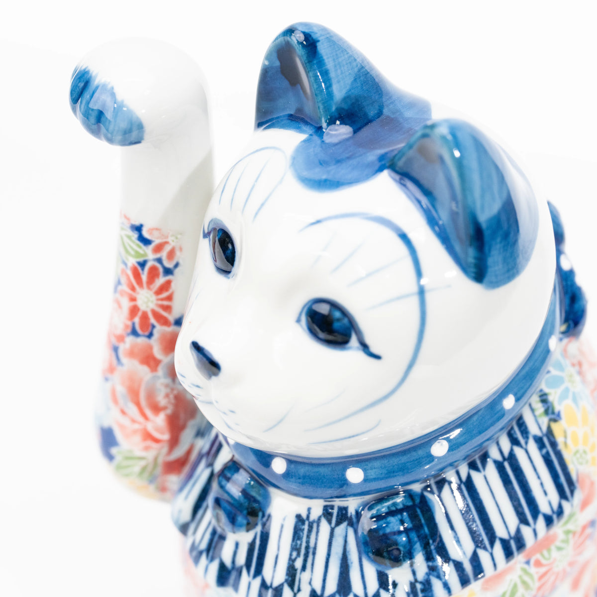 Angled close-up of the blue floral cat's face.