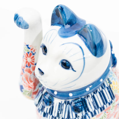 Angled close-up of the blue floral cat's face.