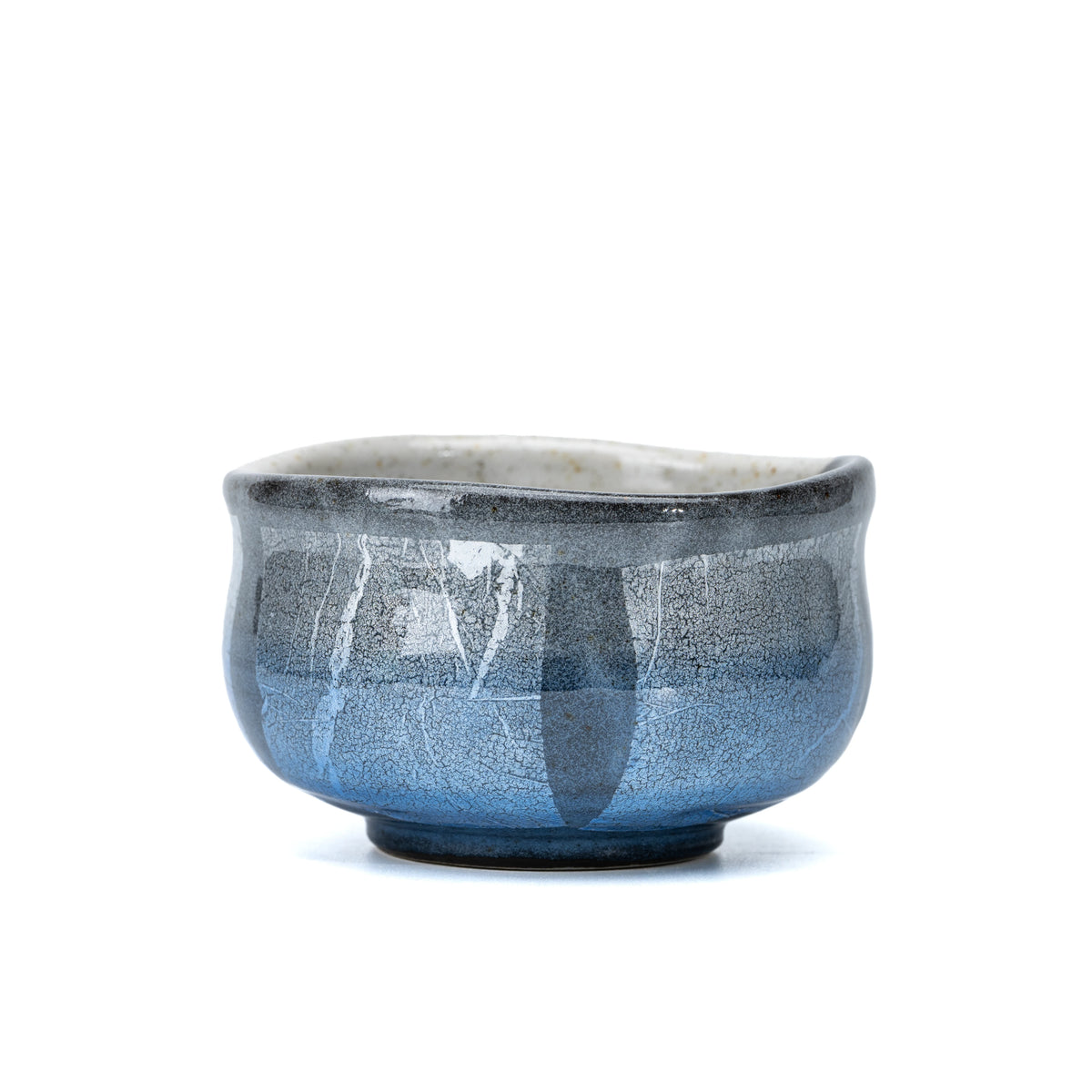 Rounded Kutani matcha bowl with pale blue and silver-foil panels on white.