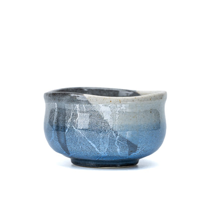 Opposite view of the bowl's pale blue and silver-white decoration.