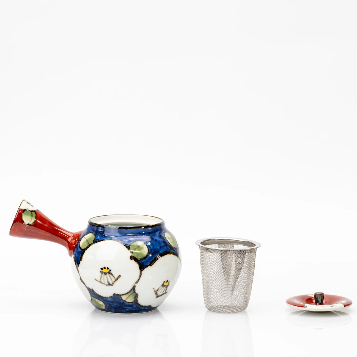 Camellia teapot with its lid removed, displayed beside the removable metal mesh tea strainer and red lid.