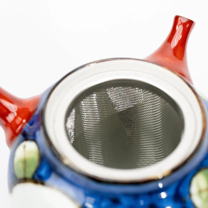 View into the open blue camellia teapot, showing the removable metal mesh basket fitted inside.