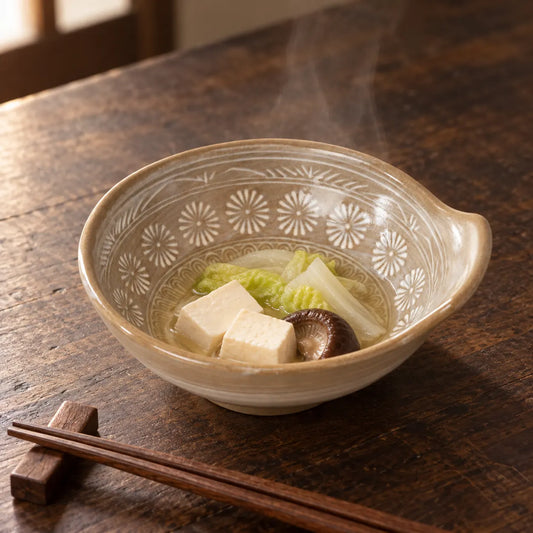 Hana Mishima tonsui bowl holding tofu, cabbage and mushroom in light broth, with its short grip visible