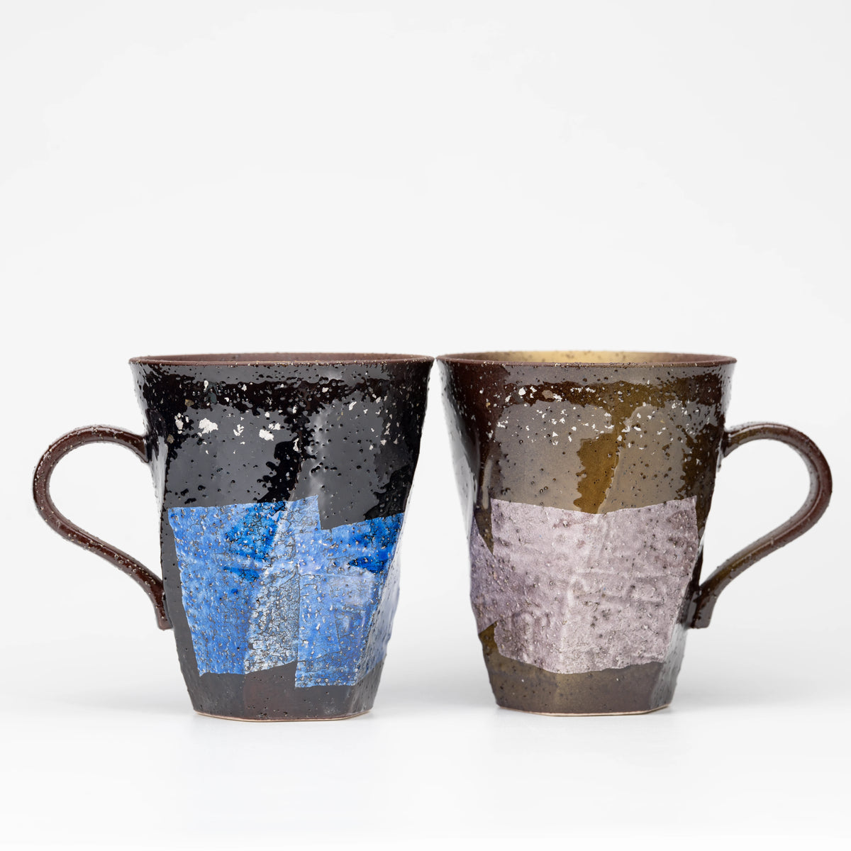 Opposite faces of the blue and lilac ginsai mug pair.