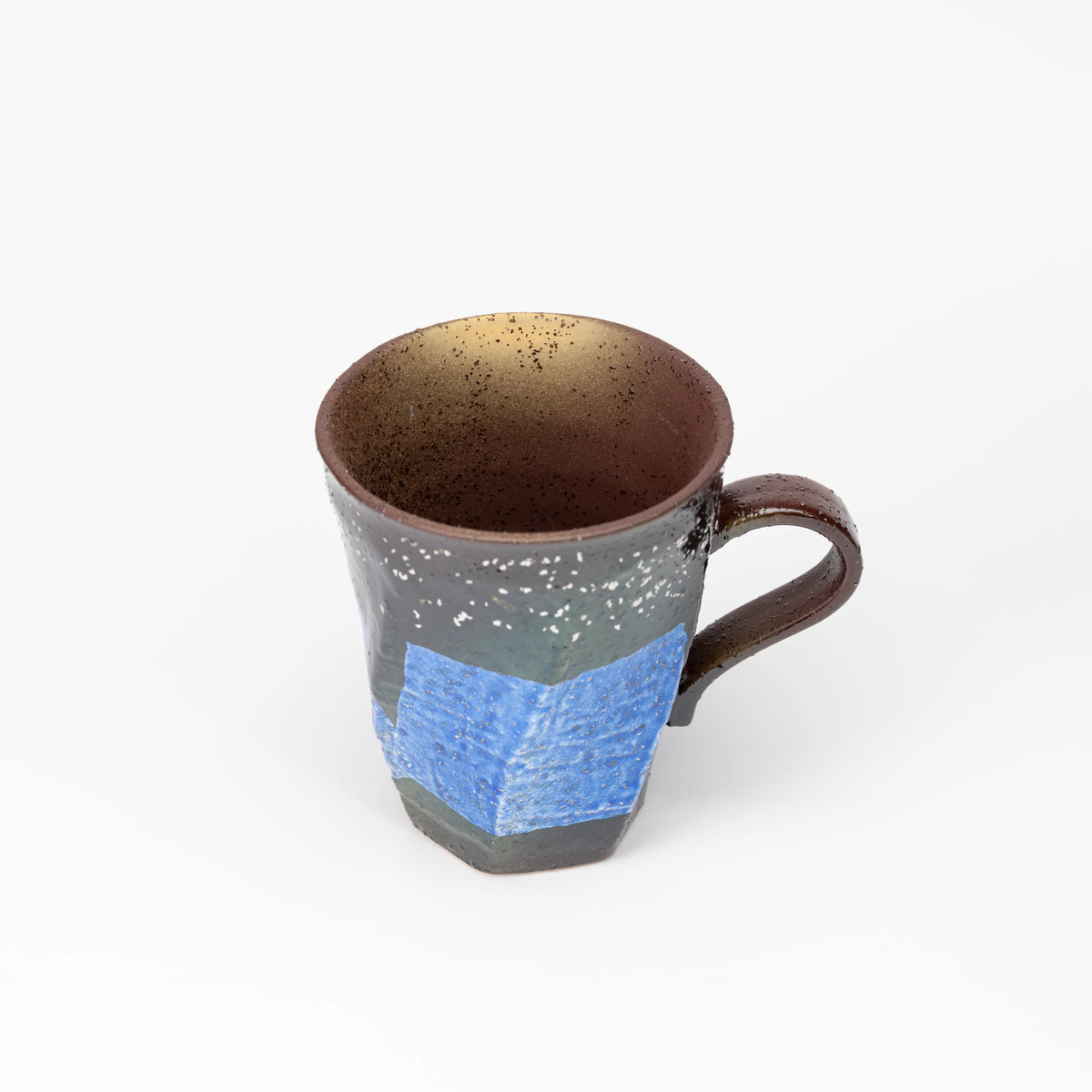 Blue silver-foil mug viewed from above.