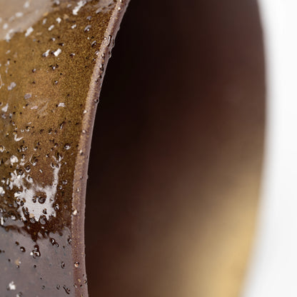 Warm brown inner rim and dark handle of the lilac mug.