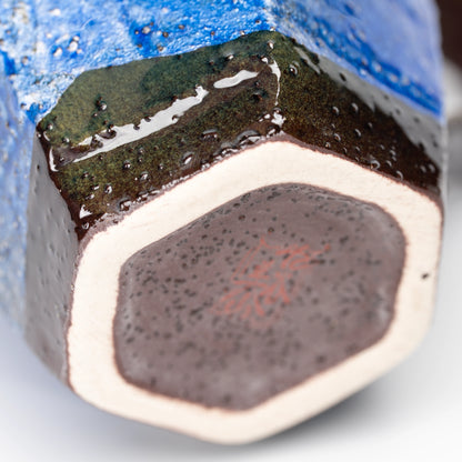 Polygonal foot beneath the blue ginsai mug.