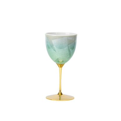 Green Kutani wine cup with a gold-colored stem and base on a white background.