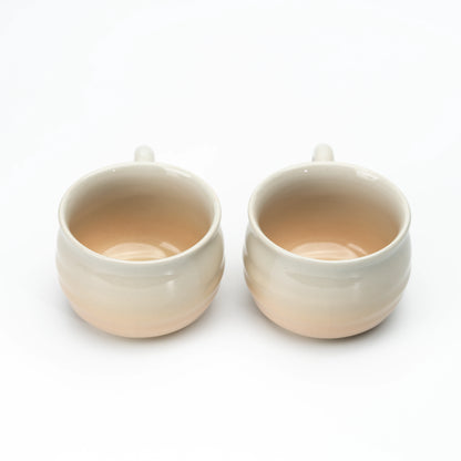 Two Hagi cups side by side, showing their interiors.