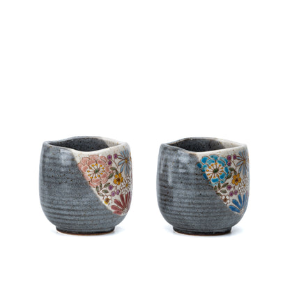 Side view of the gray Kutani mug pair with triangular floral panels.