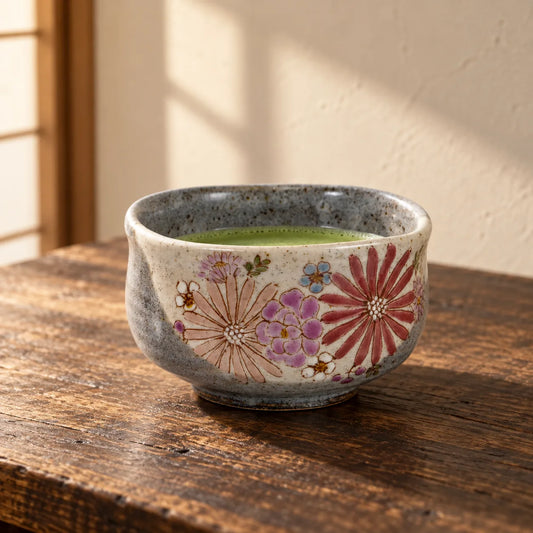 Iroe Yu Hana matcha bowl with a shallow serving of matcha on a warm wood table.