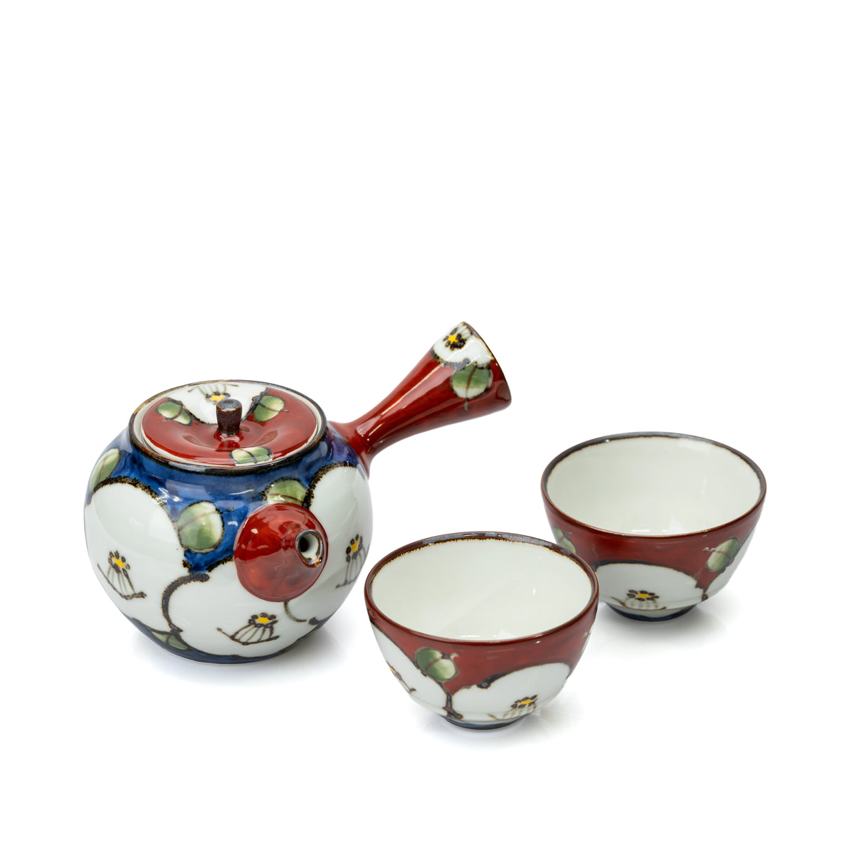 Camellia tea set with one blue and white side-handle teapot and two red cups on white.