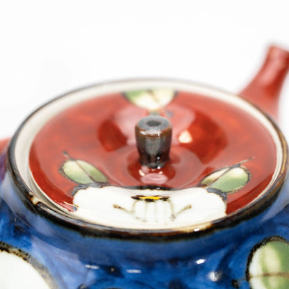 Top view of the red camellia teapot lid.