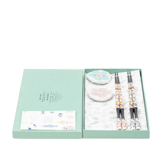 Chopstick gift set with two porcelain rests inside an open green presentation box.