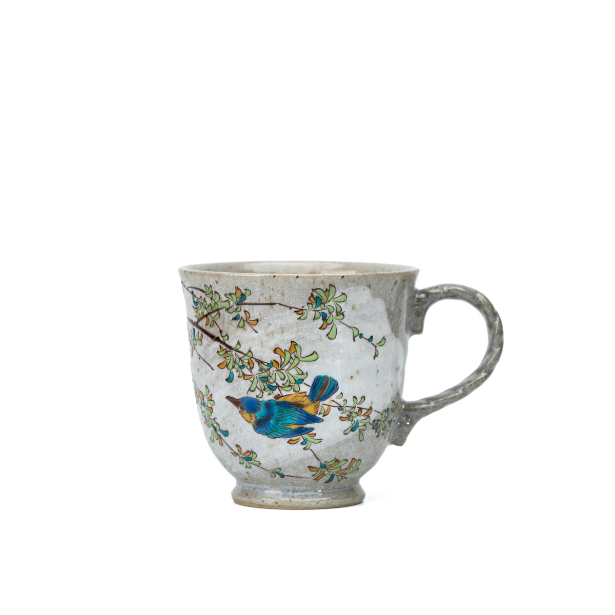Front view of a Kutani kingfisher mug with a blue kingfisher and leafy branches on a white background.