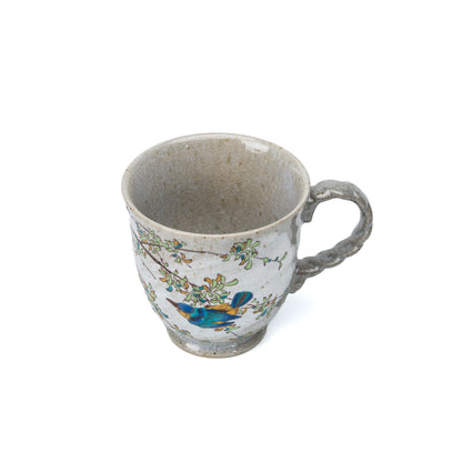 Top view of the Kutani kingfisher mug showing its opening and painted birds.