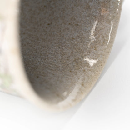 Close-up of the gray glazed interior of the Kutani kingfisher mug.