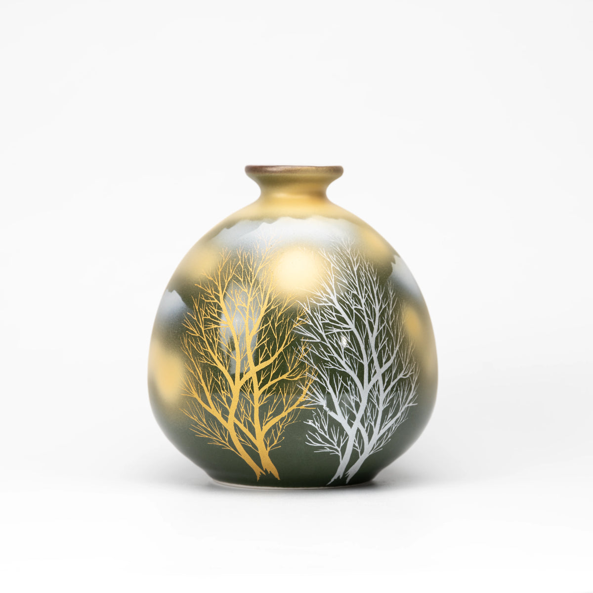 Front view of the rounded olive-green vase with gold and silver-white trees.