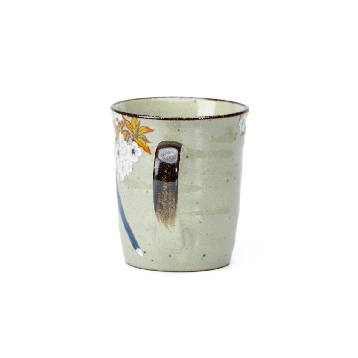 Back of the pale green mug with its dark green handle.