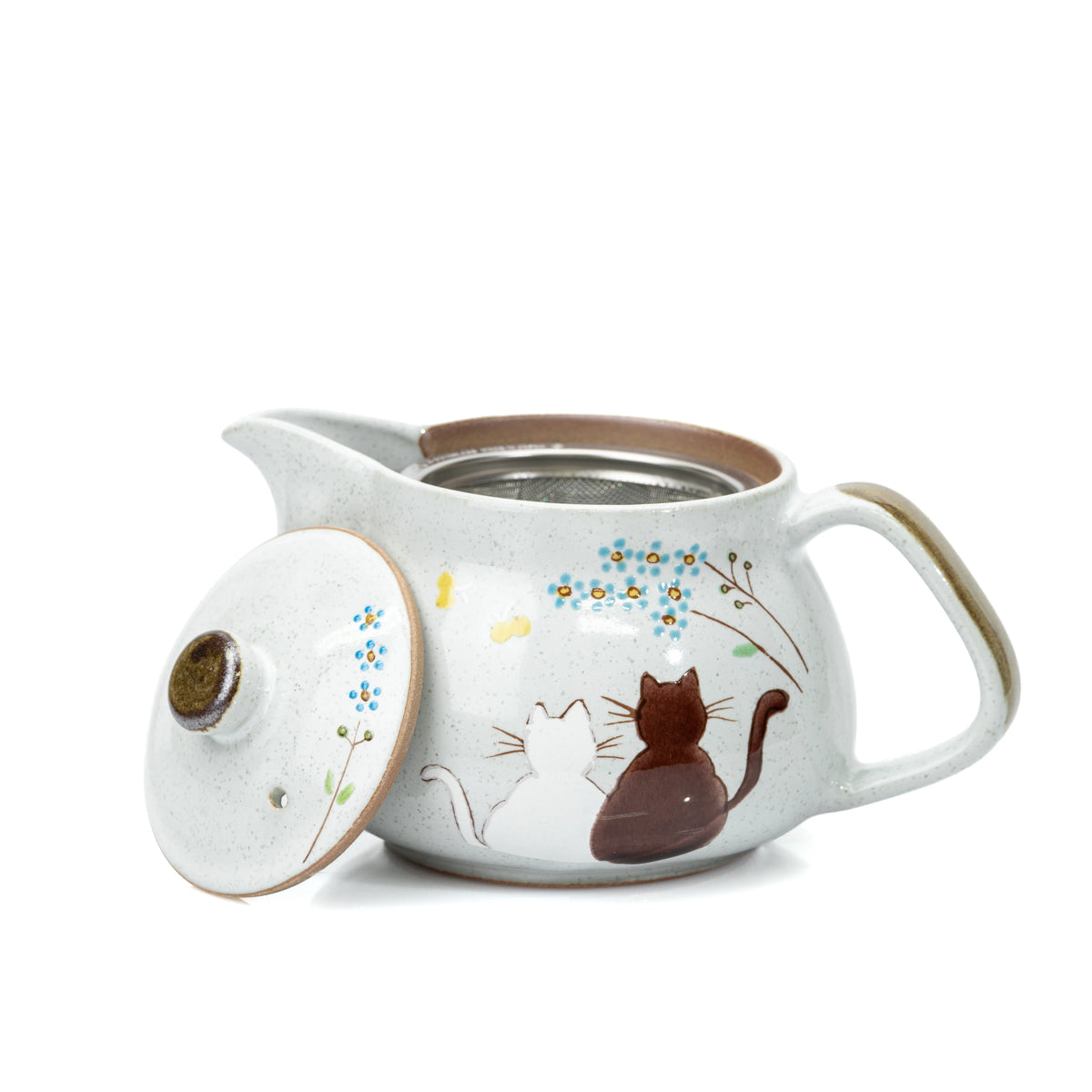 Cat teapot with its lid leaning against the body.