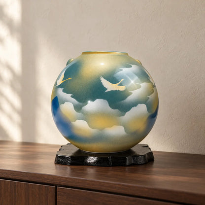 Kutani Cloud Sea Crane vase displayed empty on its black stand on a dark wood console