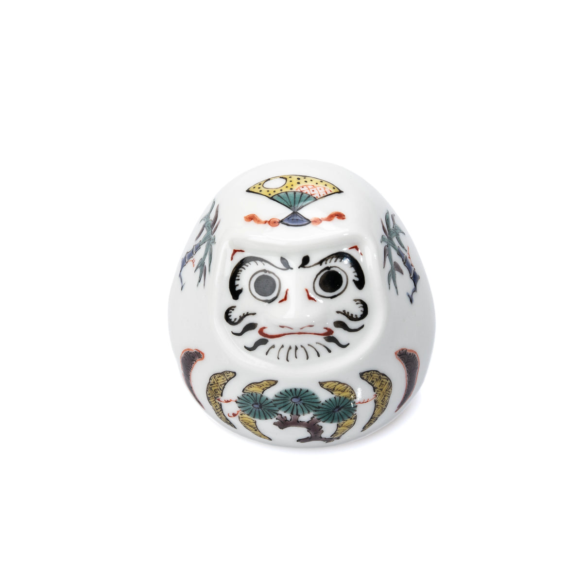 White Kutani daruma with painted pine, bamboo and plum decoration on white.