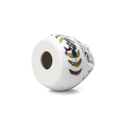 Open underside of the white porcelain daruma.