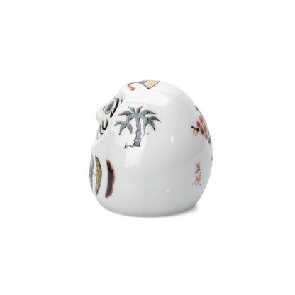 Bamboo decoration on the side of the white daruma.