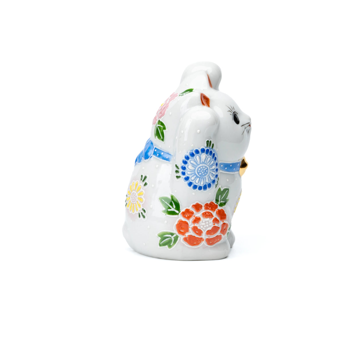 Opposite side of the white lucky cat and its raised paws.