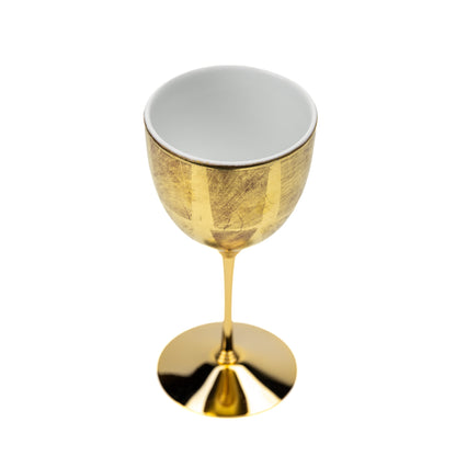 Angled top view of the gold wine cup and white interior.