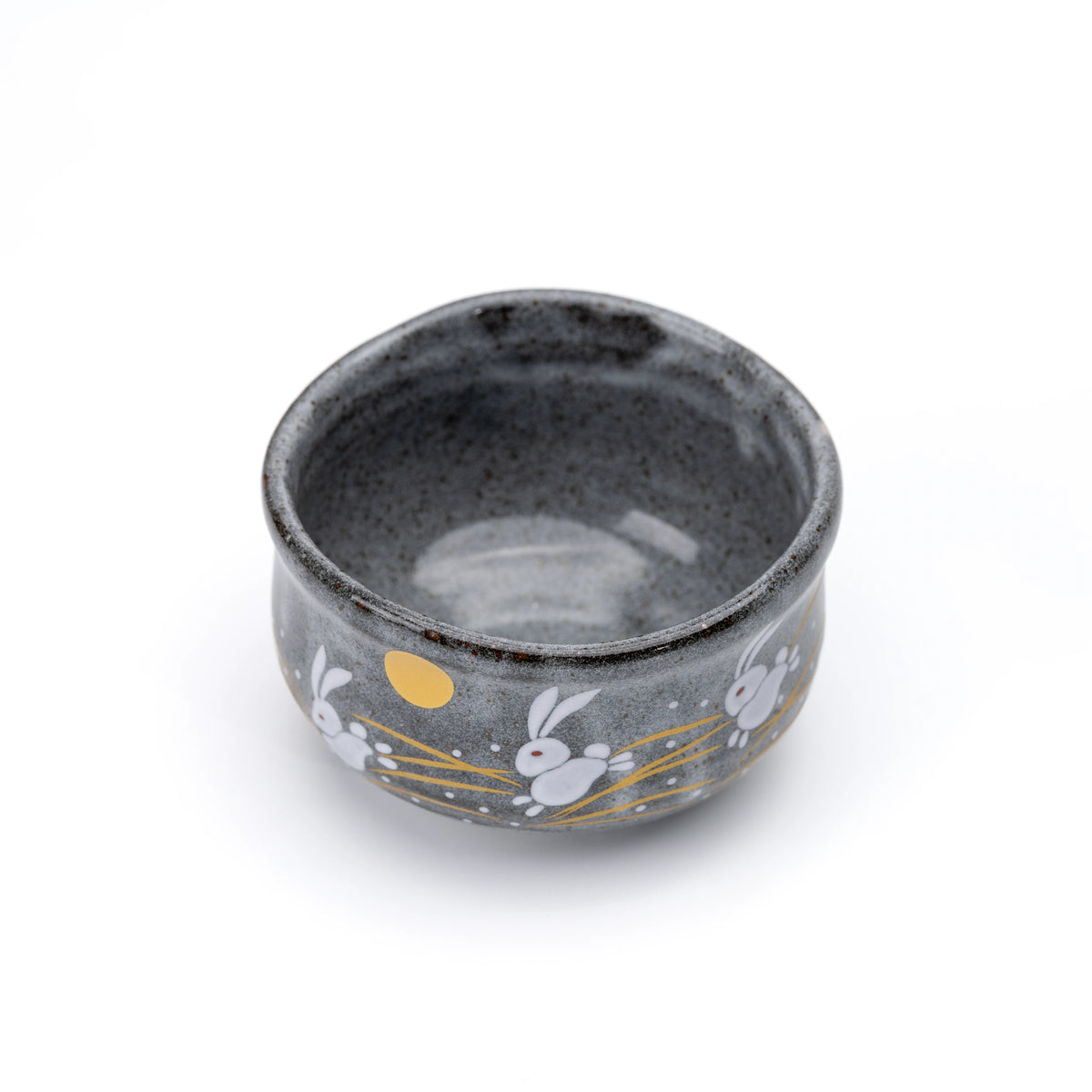 Angled overhead view into the gray glazed rabbit matcha bowl.