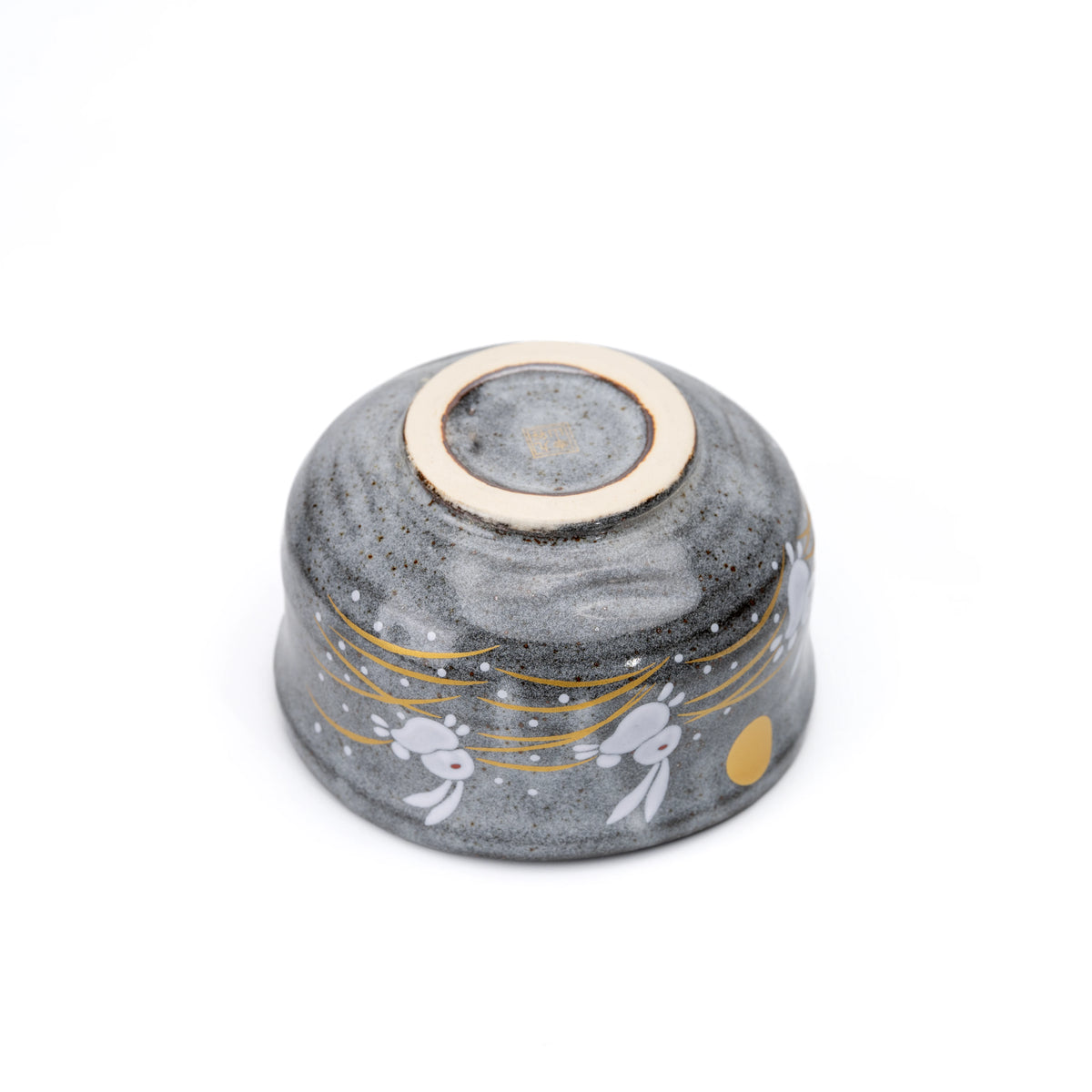 Underside and circular foot of the rabbit matcha bowl.