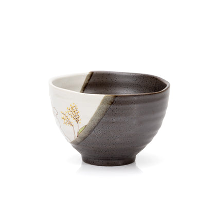 Side of the rabbit bowl showing horizontal dark glaze and a pale painted panel.
