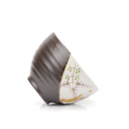 Angled view of the rabbit bowl resting on its side.