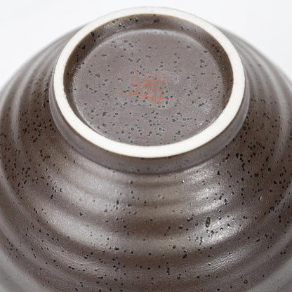 Circular foot and recessed underside of the rabbit bowl.
