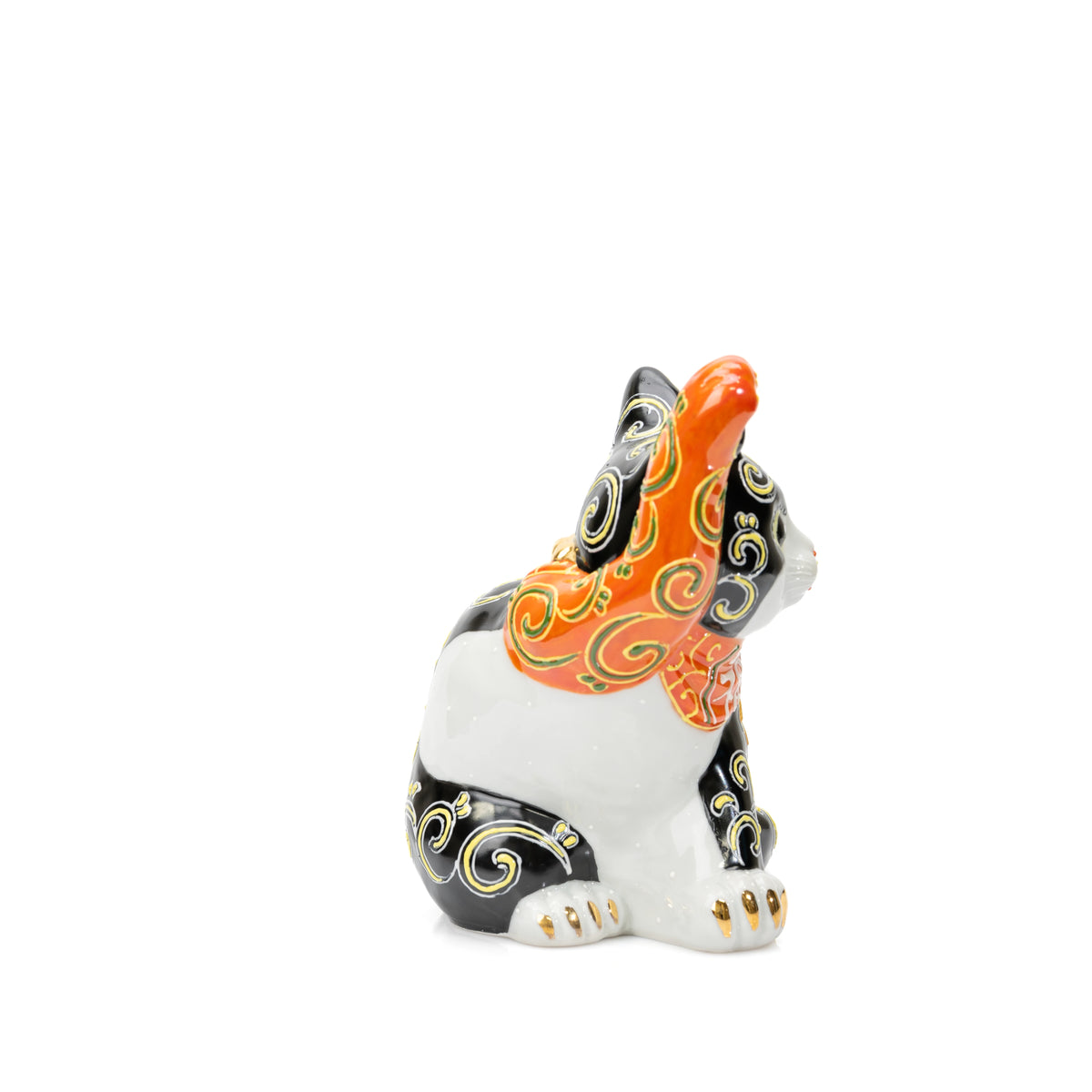 Back of the lucky cat with a white crane and orange raised paw.