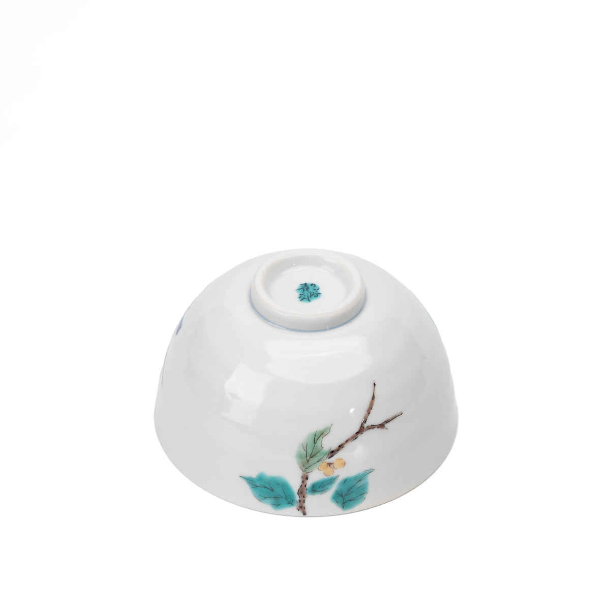 Underside of the bird rice bowl with a painted branch and maker's mark.