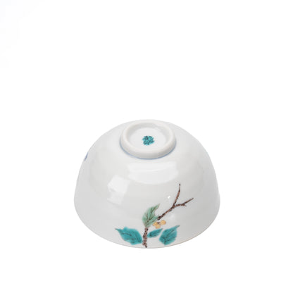 Underside of the bird rice bowl with a painted branch and maker's mark.