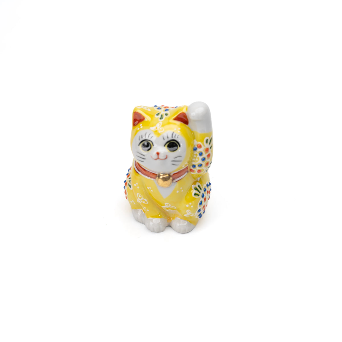 Front angle of the yellow lucky cat with one raised paw.