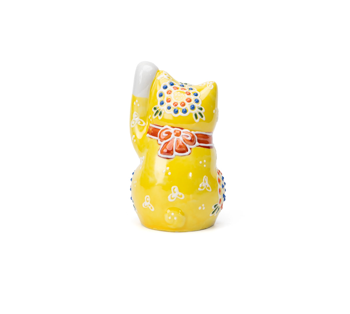 Back of the yellow cat with a red bow.