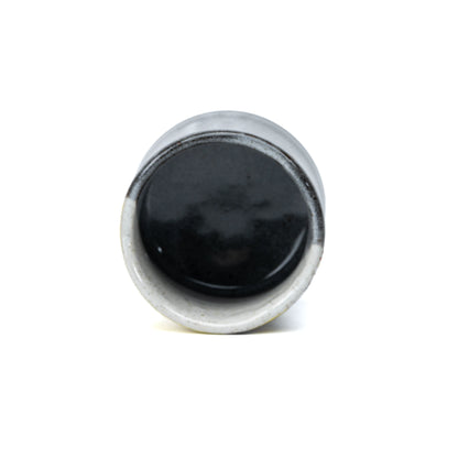 Overhead view into the dark glazed yunomi interior.