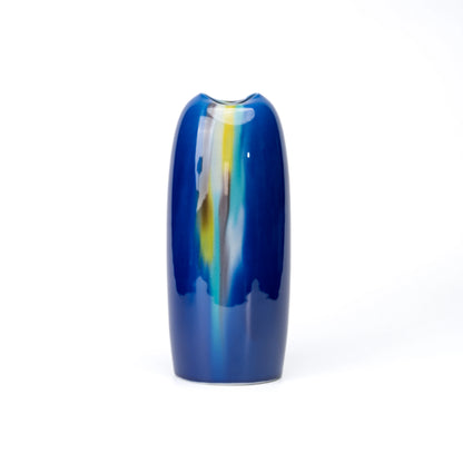 Tall blue Kutani porcelain vase with flowing green, yellow and pale blue glaze on white.